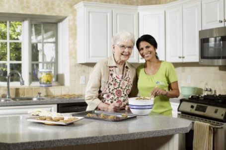 Caregiver providing non-medical care and companionship to senior in seniors home