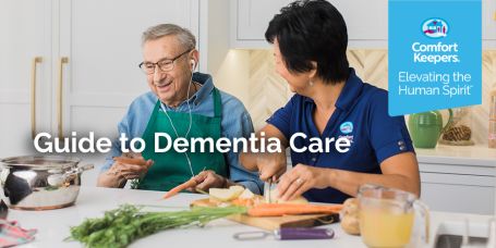 Caregiver preparing meal with senior with dementia.