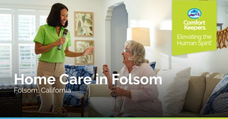 Caregiver and senior woman singing together