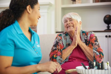 A caregiver and a client having an engaging conversation.