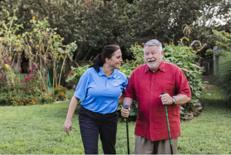 Senior walking with Caregiver near Chisago Lakes area