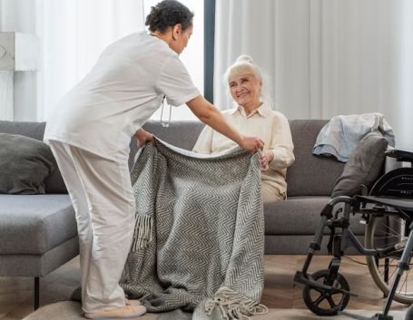 Caregiver is taking care of a client with post-surgery care