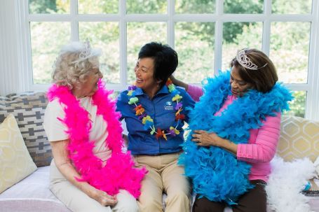 Caregiver having fun with clients