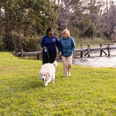 Comfort Keepers Caregiver and client enjoying a walk.