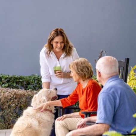 Family daughter and pet share a joyful moment together 