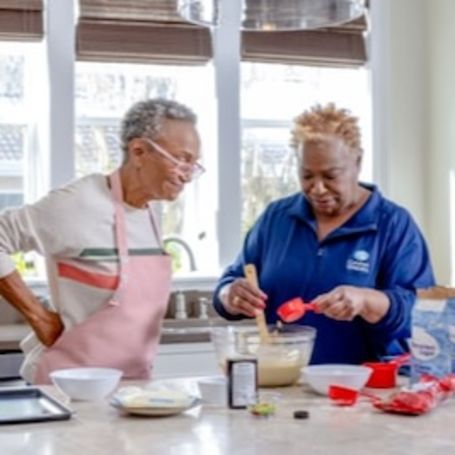 Caregiver helping client with meal prep