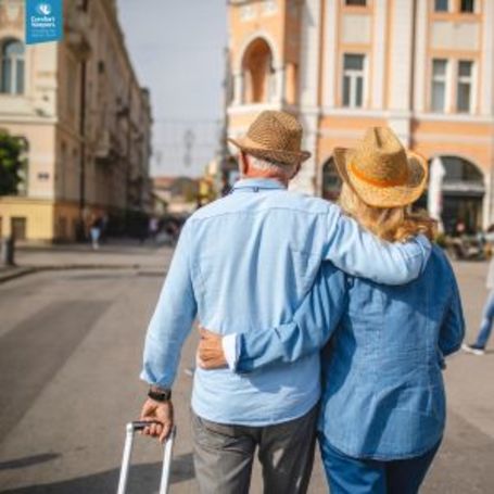Two seniors embark on a travel journey together.