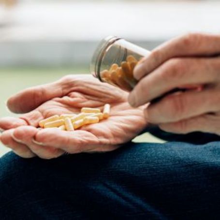 Comfort Keepers client tracks his medication.