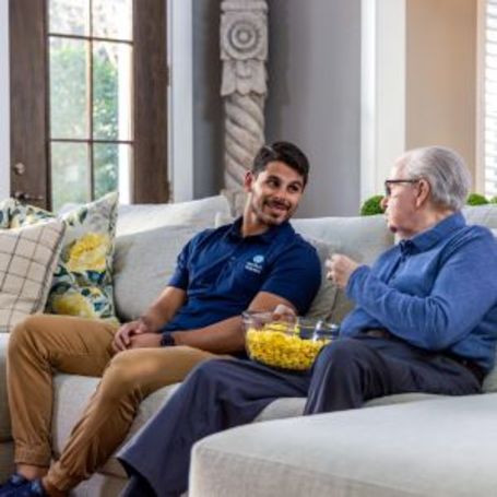 Comfort Keepers Caregiver has a conversation with a client. 