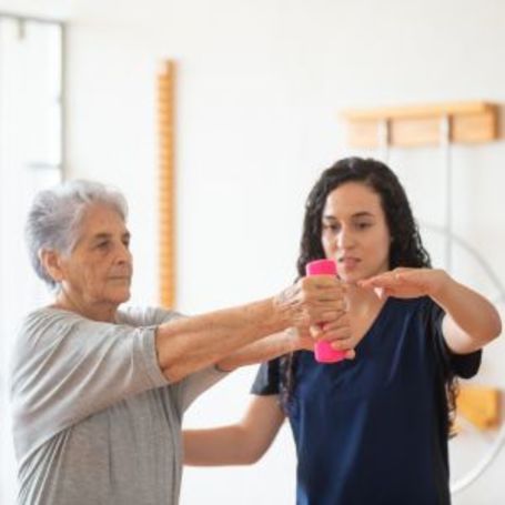Comfort Keepers client going through physical therapy