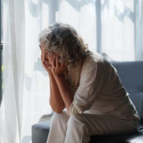 Comfort Keepers client sits at home