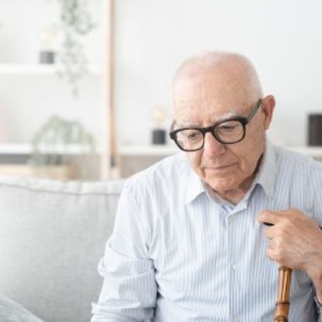 Comfort Keepers client sits at home