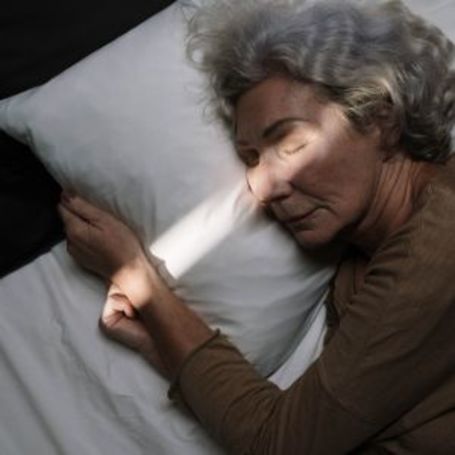 Comfort Keepers senior sleeps calmly in bed
