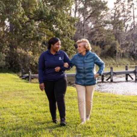 Comfort Keepers caregiver and client share a walk together