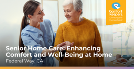 Smiling caregiver in blue uniform assisting an elderly woman in a mustard sweater at home, promoting senior home care in Federal Way, CA.