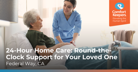 Caregiver in blue uniform smiling while assisting an elderly woman in bed, promoting 24-hour home care in Federal Way, CA.