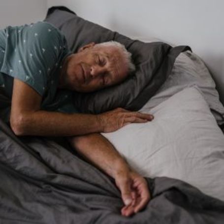 Comfort Keepers senior home care client sleeps in bed