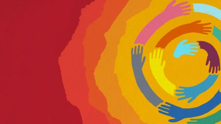 Multi-colored hands swirling in a circle