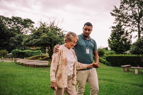 A senior enjoying a walk in a Durango neighborhood with a Comfort Keepers caregiver.