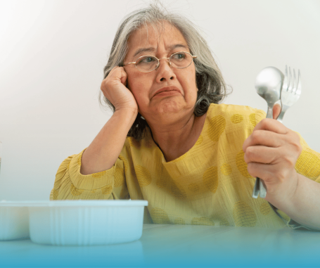 upset senior with utensials 