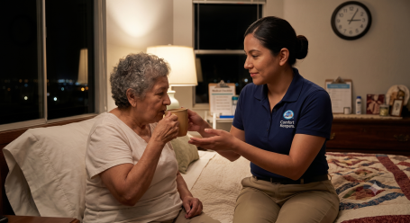 caregiver helping an elderly woman