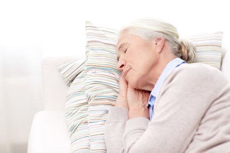 senior sleeping at home