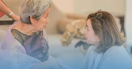 senior and adult child talking