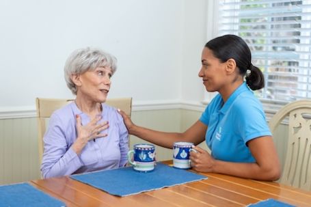 caregiver and client having coffee