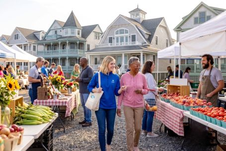 Comfort Keepers caregiver walking with an older woman at a Monmouth County Jersey Shore farmers market