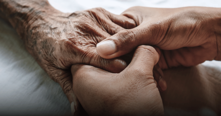 holding senior hands