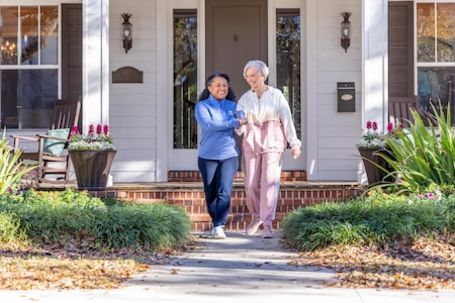 caregiver and client taking a walk