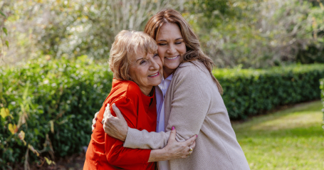 client hugging adult child
