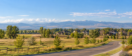 Neighborhood and open fields near Timnath, CO with mountain views
