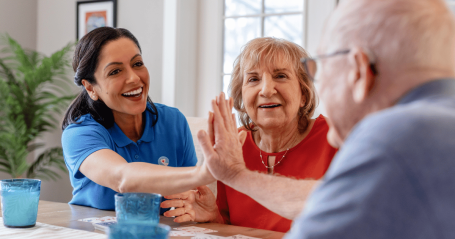 caregiver with elderly couple
