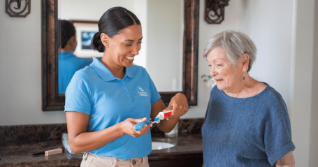 caregiver helping client with toothbrush