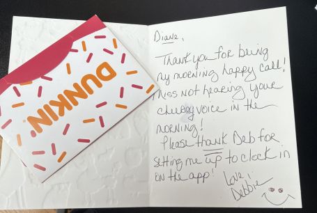 Handwritten thank-you card from a caregiver to an office staff member, with a Dunkin gift card.