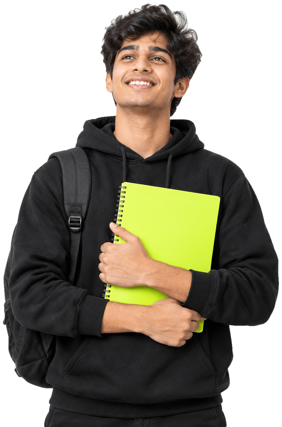 Smiling Indian student in a black hoodie holding a lime notebook, looking up with optimism