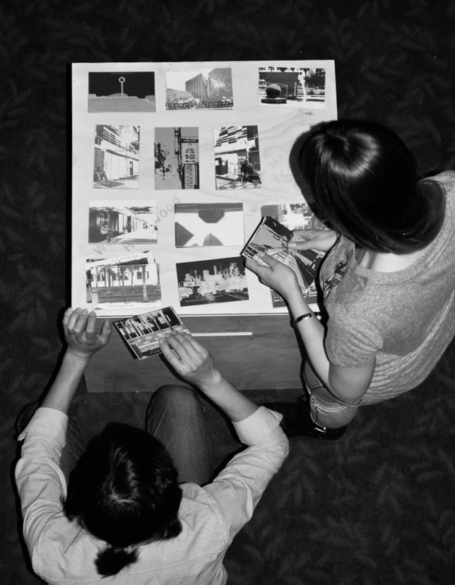 Participants writing on postcards