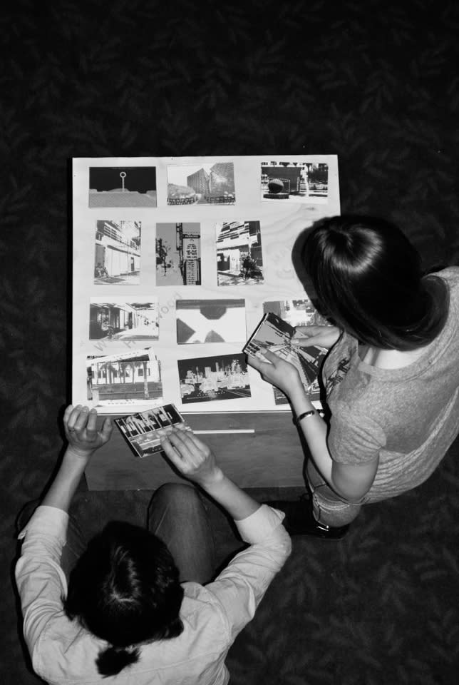 Participants writing on postcards