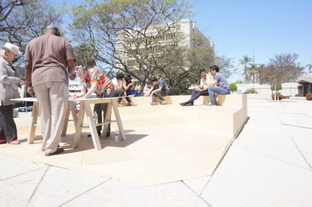 Participants at table on sawhorses