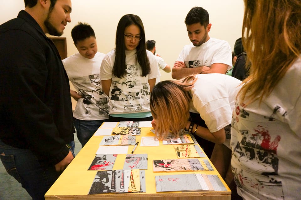 Participants writing on postcards