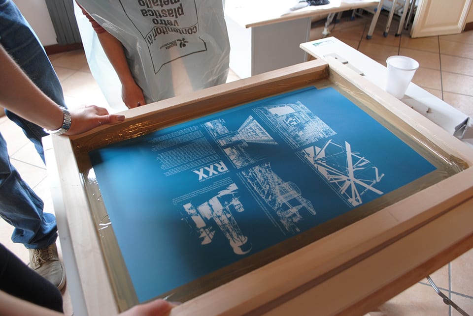 Hands holding silkscreen