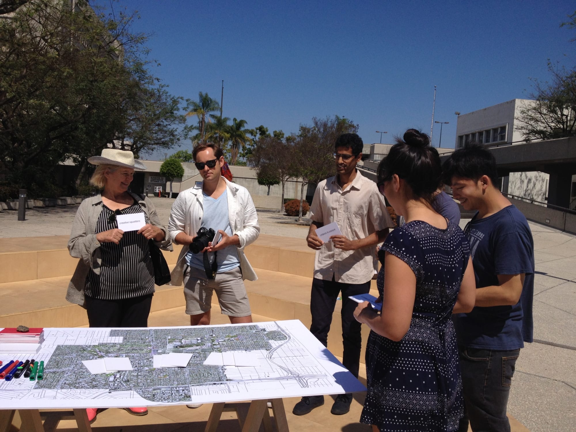 Particpants looking at map