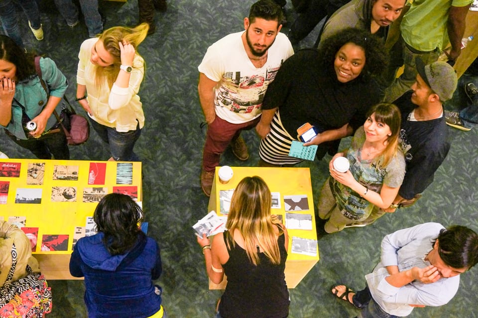 Participants writing on postcards