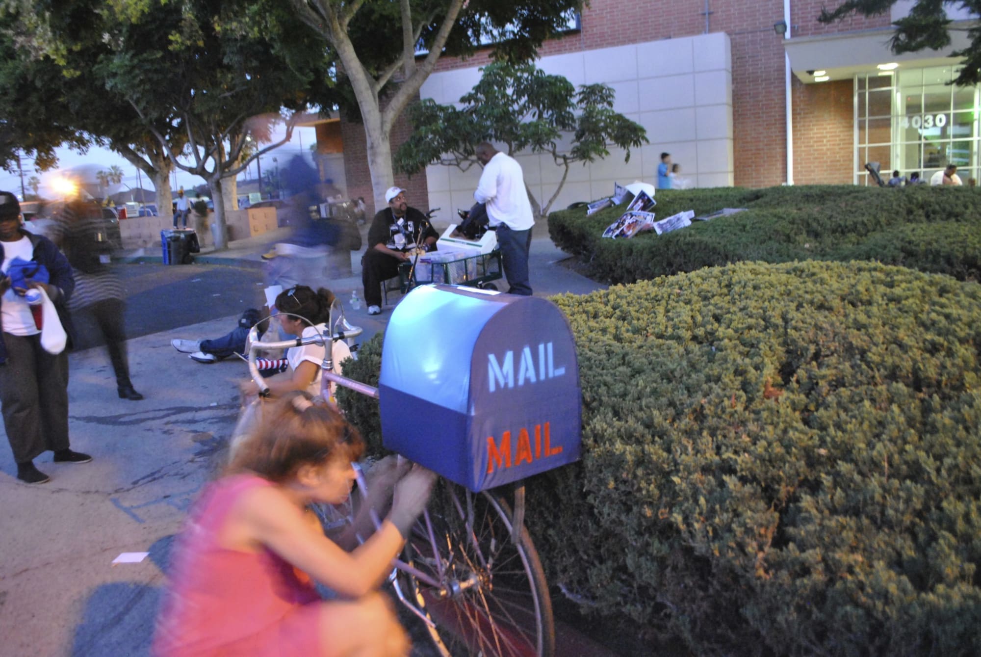 Woman with bike and mailbox
