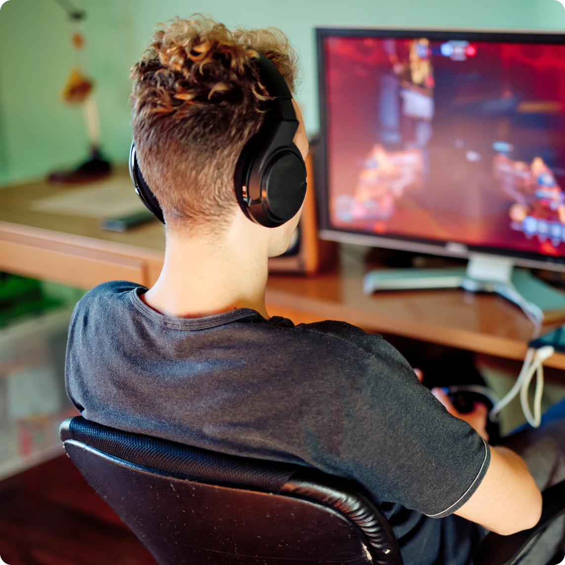 young man playing video games on computer