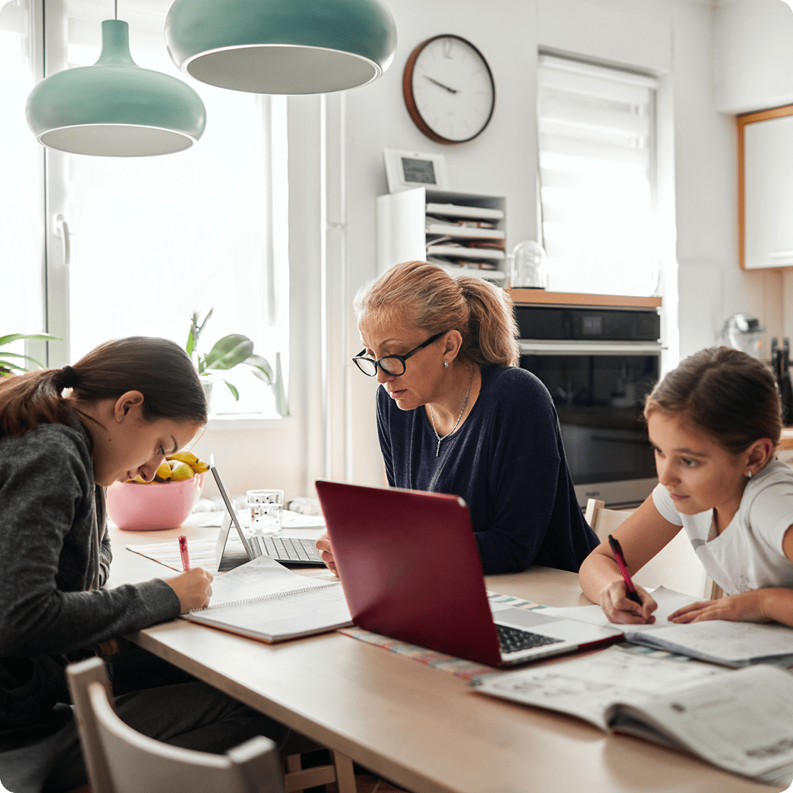 family working at dinner table