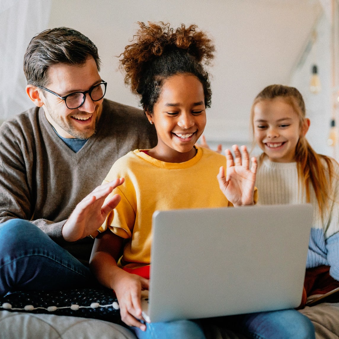 Dad and daughters on a video call