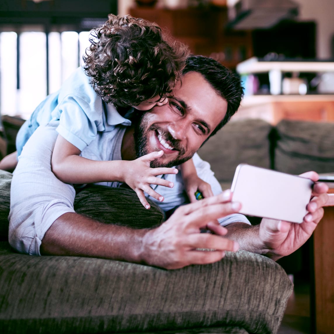 Father taking selfie with his son