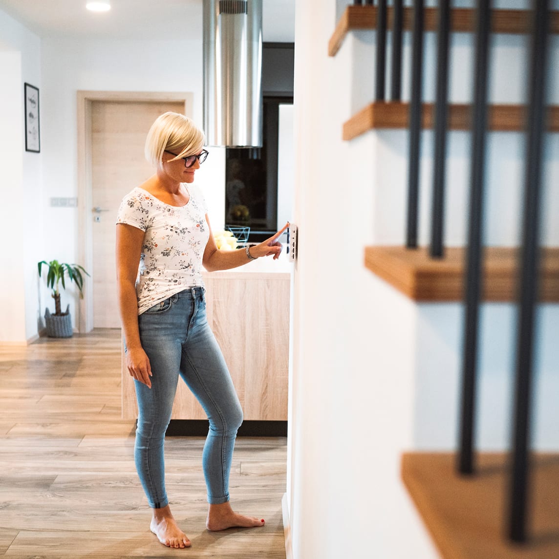 Woman using smarthome panel